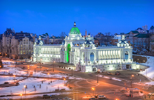 The Palace of Farmers in Kazan in the light of night lights. View from the Kremlin. Caption: Palace of Farmers