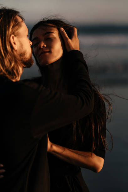 istock Attractive man and woman enjoying romantic evening on sunset 1223951632