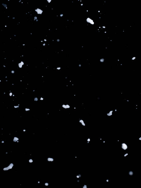 istock Snowfall photographed in a black background in the studio 1223953690
