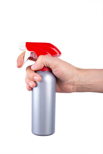istock spray detergent in hand. place for text. 1223954763