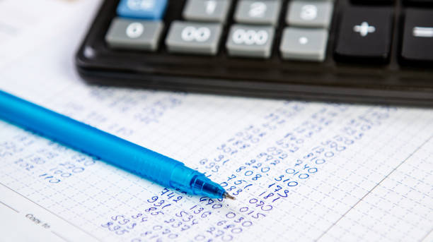 istock Pen and calculator. Background Items for doing business in the office in the composition. 1223954800
