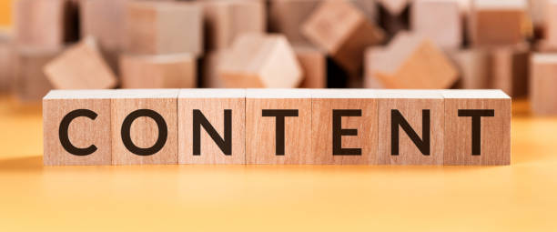 istock Word content on wooden cubes on a yellow background with blurred cubes. 1223954802