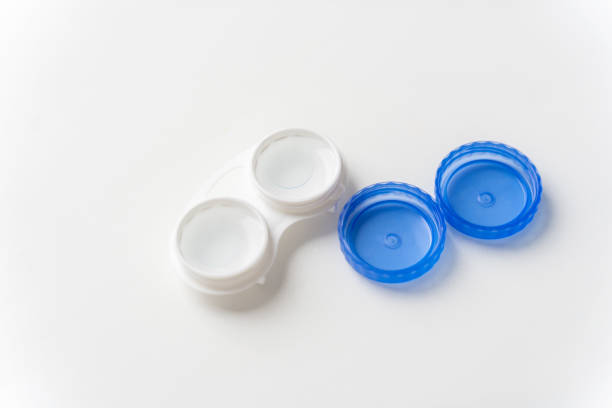 istock Contact lenses are in solution in the contact lens container on a light background. Contact lenses for correcting vision. 1223954878