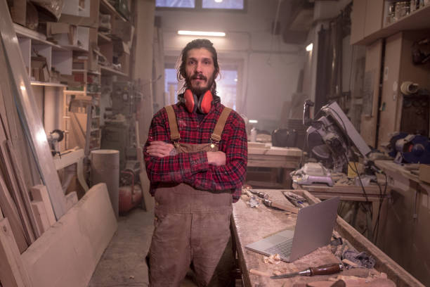 istock Man in carpentry workshop with arms crossed 1223955985