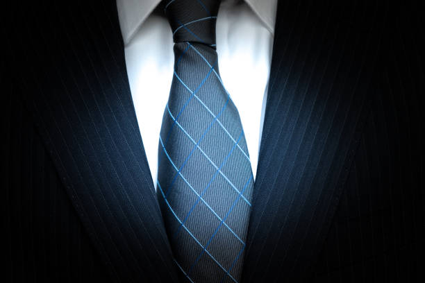Blue striped tie on a dark wooden table