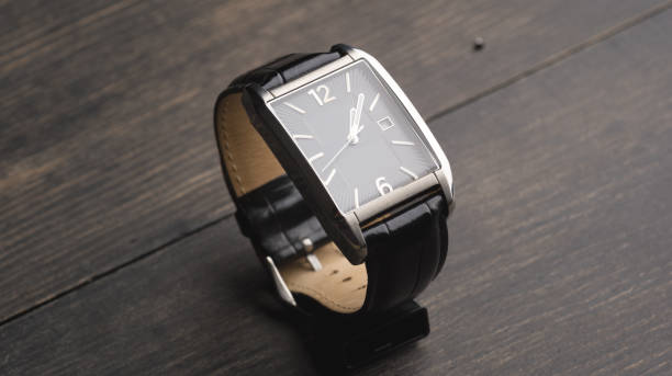 istock Black watch on a wooden surface 1223959317