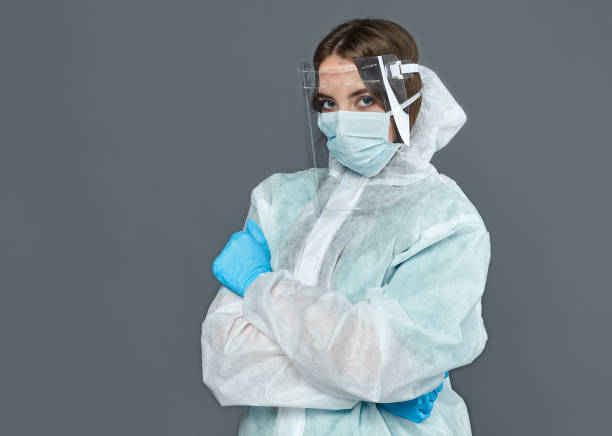 istock female doctor in protective suit and gloves 1223959999