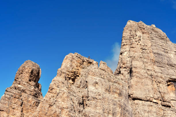 jumps towards the refuge path tower of Pisa latemar (predazzo pampeago) dolomites alto adige Italy