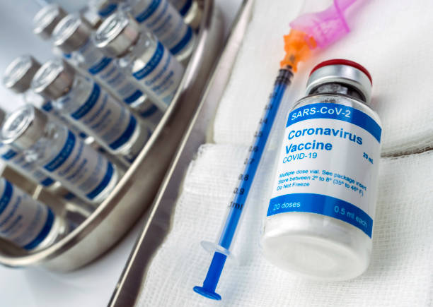 istock Coronavirus covid-19 experimental vaccine in a laboratory, conceptual image 1223960489