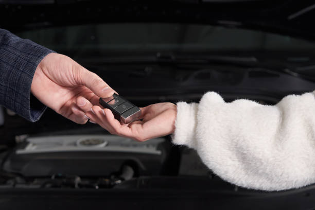 istock Mechanic giving car keys to customer after servicing 1223962950