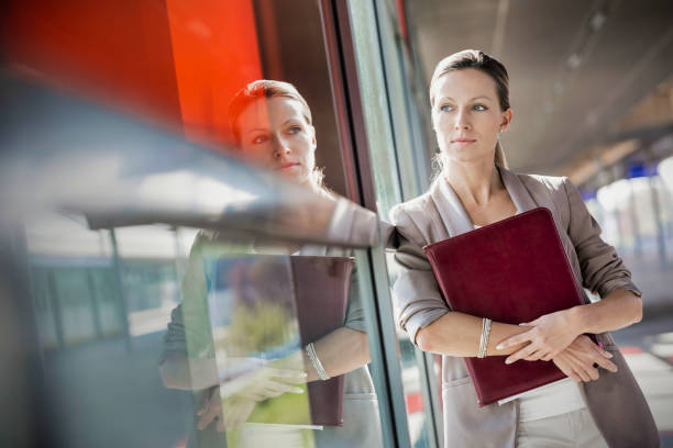 Young businesswoman in suit walking in office