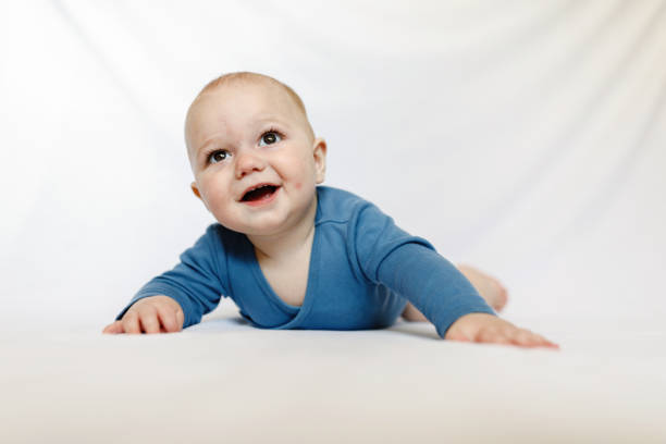 istock Cute eight month baby boy portrait on white background 1223965949
