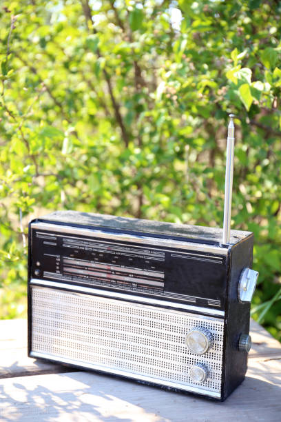 istock Antique radio with antenna on a green background 1223966310
