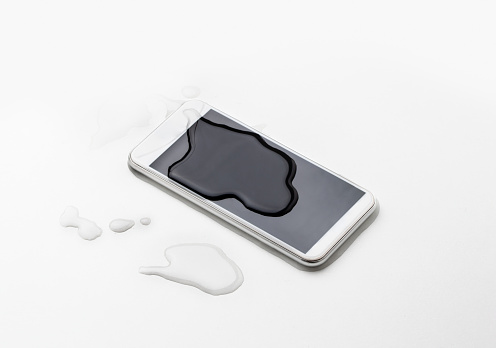 water drop on smartphone mobile on top view, waterproof phone concept