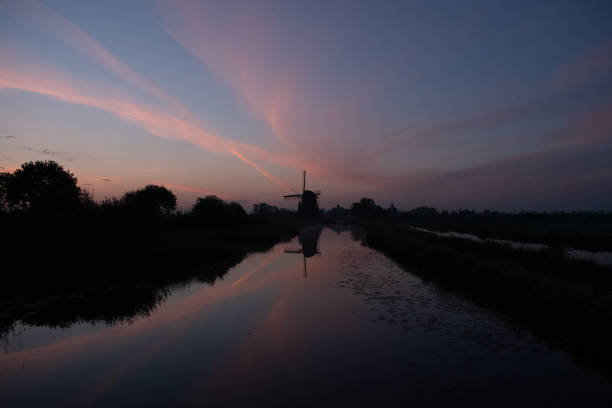 A morning sunrise at a dutch windmill