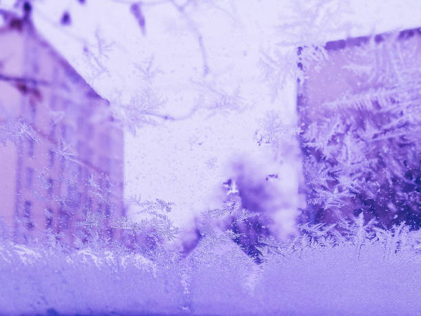 istock winter through frozen glass abstract background. wintry frosty pattern on glass. abstract background of ice frozen window. 1223974747