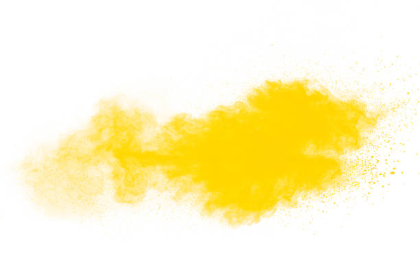 istock Yellow dust particles explosion on white background.Yellow powder dust splash. 1223975783