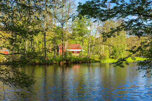 Mullsjö, Sweden - June 04, 2017: Cottage by the river in the forest
