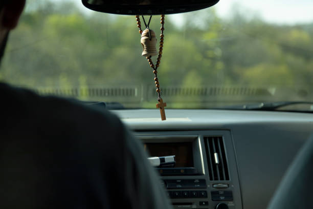 istock cross necklace in the car 1223978606