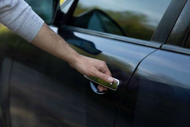istock man open car door 1223978618