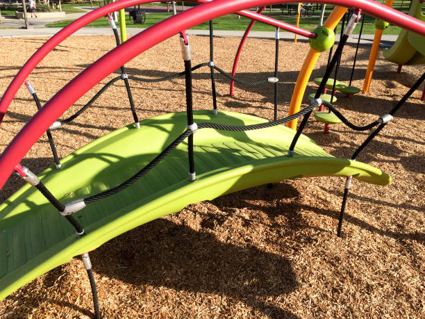 istock New modern Playground equipment green plastic slide at park school 1223982041