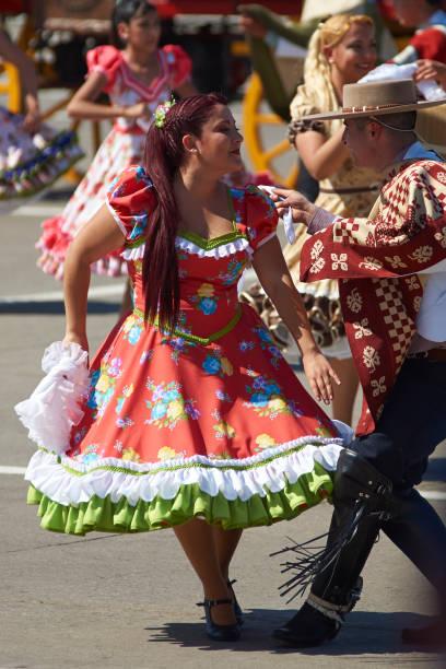 Independence Day Parade Santiago, Chile - September 19, 2016:Traditional cueca dance group performing at the annual Military parade as part of the Fiestas Patrias commemorations in Santiago, Chile. chilean dress pictures stock pictures, royalty-free photos & images