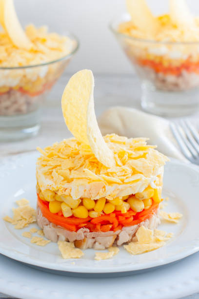 istock salad with corn, carrots, chicken and chips, salad Sail, selective focus 1223984755
