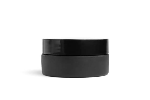 istock Black cream container jar isolated on white background, blank. Men's cosmetics concept 1223985612