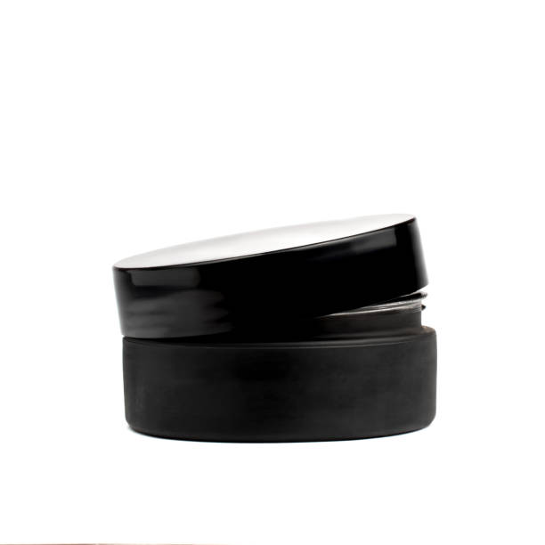 istock Black ajar container cream jar isolated on white background, blank. Men's cosmetics concept 1223985633