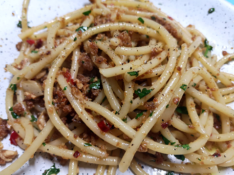 Plate of bucatini pasta with anchovies