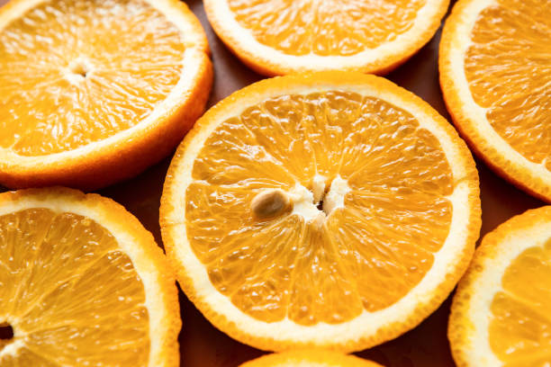 istock slices of juicy orange background, texture 1223987592