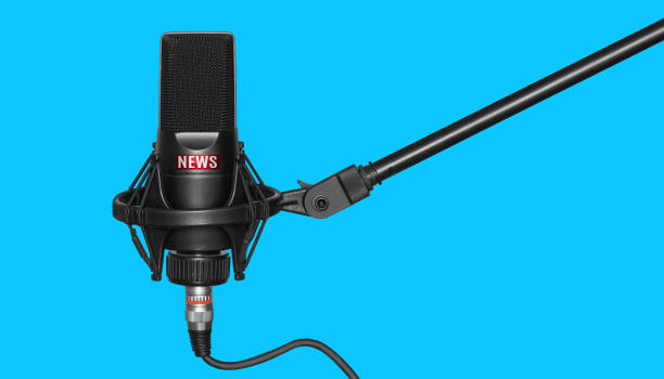 istock Professional black microphone with news logo isolated on blue 1223988647