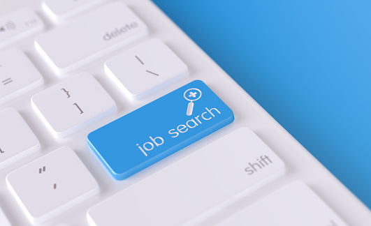 Job search icon written on a blue button of a computer keyboard. Horizontal composition with selective focus and copy space. High angle view. Horizontal composition with copy space. Employment and labor concept.