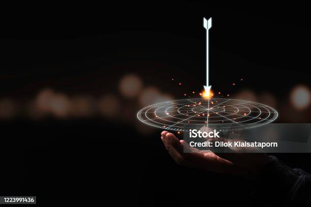 Hand Holding Virtual Target Board And Arrow With Bokeh Background Keeping And Setup Objectives And Target For Business Investment Concept Stock Photo - Download Image Now