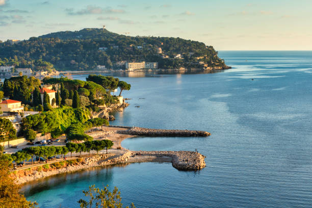 Panorama on the coast of Saint-Jean-Cap-Ferrat, Côte d'Azur, France Saint-Jean-Cap-Ferrat is a French commune located in the Alpes-Maritimes department in the Provence-Alpes-Côte d'Azur region. Its inhabitants are called the Saint-Jeannois.
the trail between Saint-Jean-Cap-Ferrat and Beaulieu-sur-Mer
The trail starts with a magnificent view of the port of Saint-Jean-Cap-Ferrat, Cros deï Pin beach and Pointe Saint-Hospice. After passing Fontettes Point, you see the islets of Rompa Talon Point. On the right, on the heights of the cliffs, the picturesque villages of Eze and La Turbie stand out while below, the town of Cap d'Ail is drawn along the coast. The last course closing the horizon is Italy. d'azur stock pictures, royalty-free photos & images