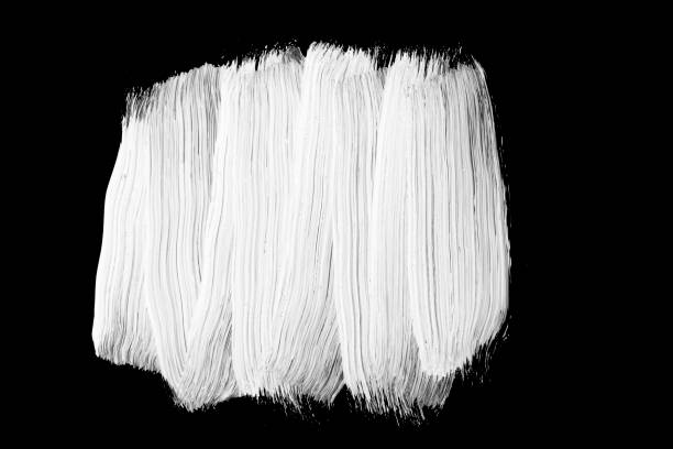 White oil paint on black background, brush strokes paint, texture