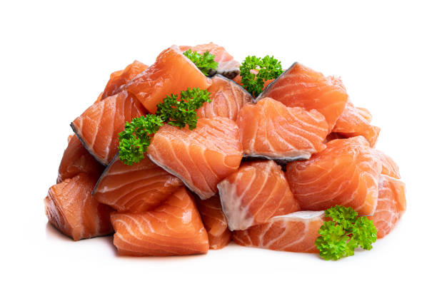 istock Fresh salmon fillet cubes isolated on white 1223993384