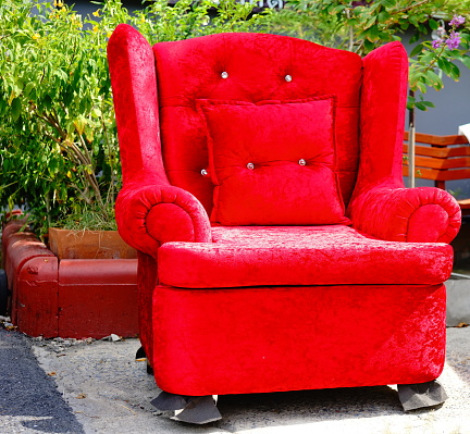 Chair decoration with red velvet fabric and Red pillow on chair.