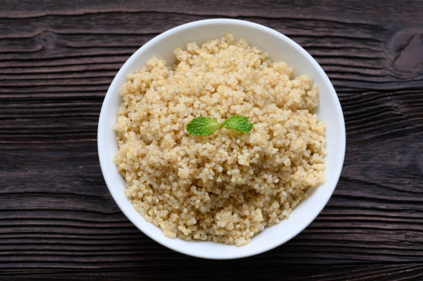 istock Bowl of boiled quinoa on wood background 1223996053