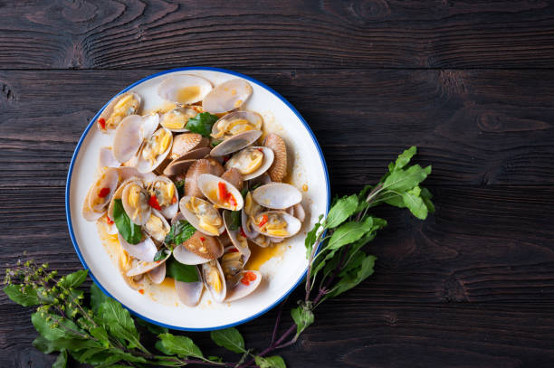 istock Stir fried Spicy Clam (Surf clam, Short necked clam, Carpet clam, Venus shell, Baby clam) with Thai Holy Basil 1223996098