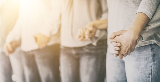 istock Patients on group therapy are holding hands. 1223996770