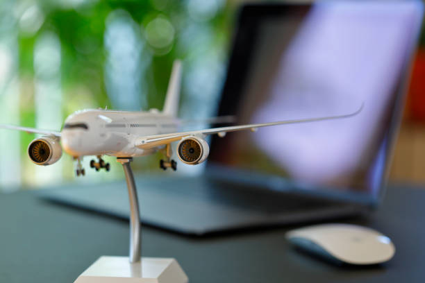 istock Airplane model in front of a Laptop 1223996810