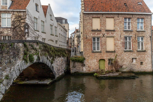 istock Buildings around channels and bridge in Bruges 1223998174