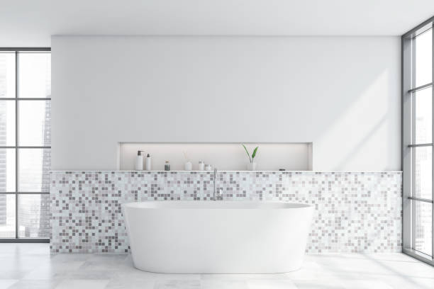 istock White mosaic bathroom interior with tub 1223998281