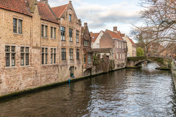 istock Buildings around channels and bridge in Bruges 1223998335
