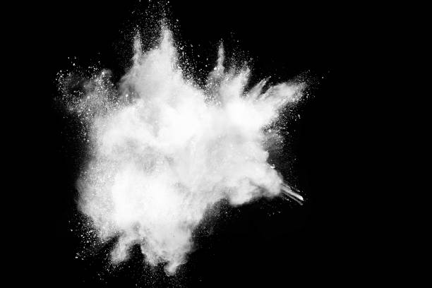 istock Freeze motion of white color powder exploding on dark background. 1224001296