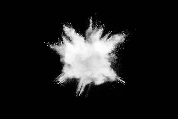 istock Freeze motion of white color powder exploding on dark background. 1224001664