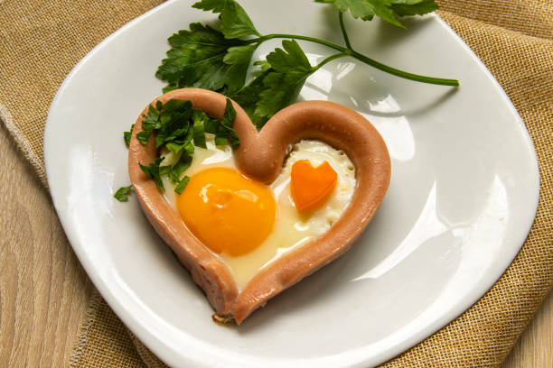 istock breakfast - toast, egg, sausage and vegetables. Breakfast for the beloved. 1224002421