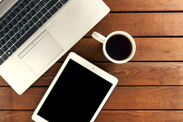 istock set of modern computer devices - laptop, tablet, notebook and  cup of tea 1224003822