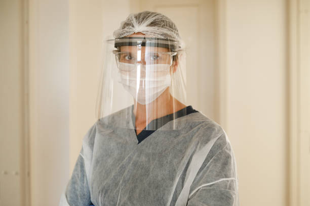 istock Female health care worker using heavy protective equipment 1224004184